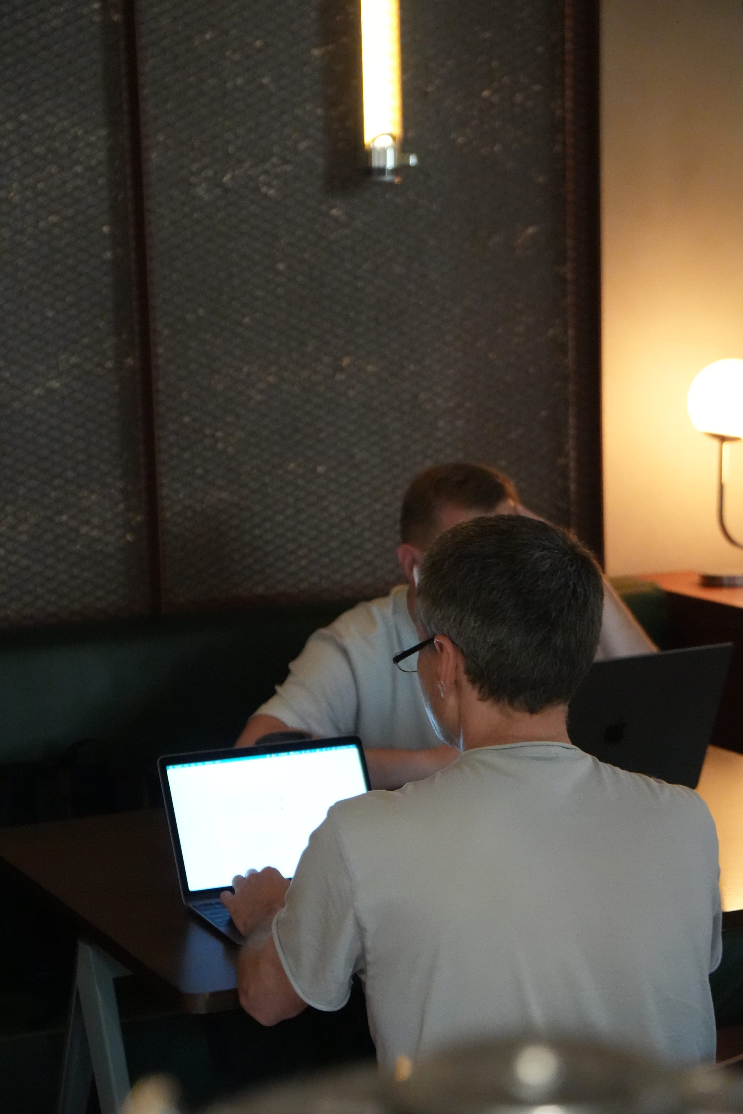 Cafe Cursor Ghent, 23 May 2026. Two builders coding in a booth.