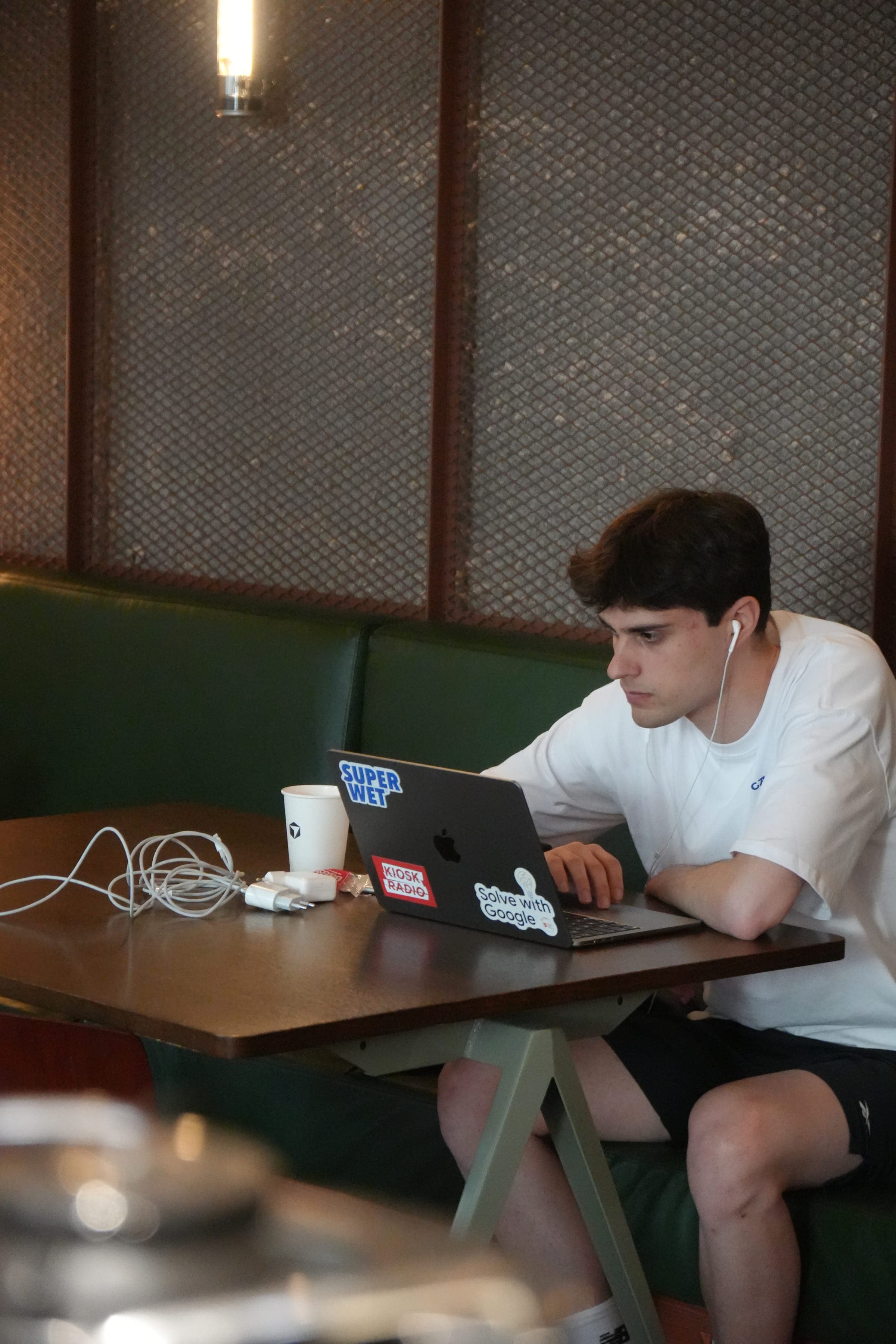 Cafe Cursor Ghent, 23 May 2026. A builder working on a laptop.