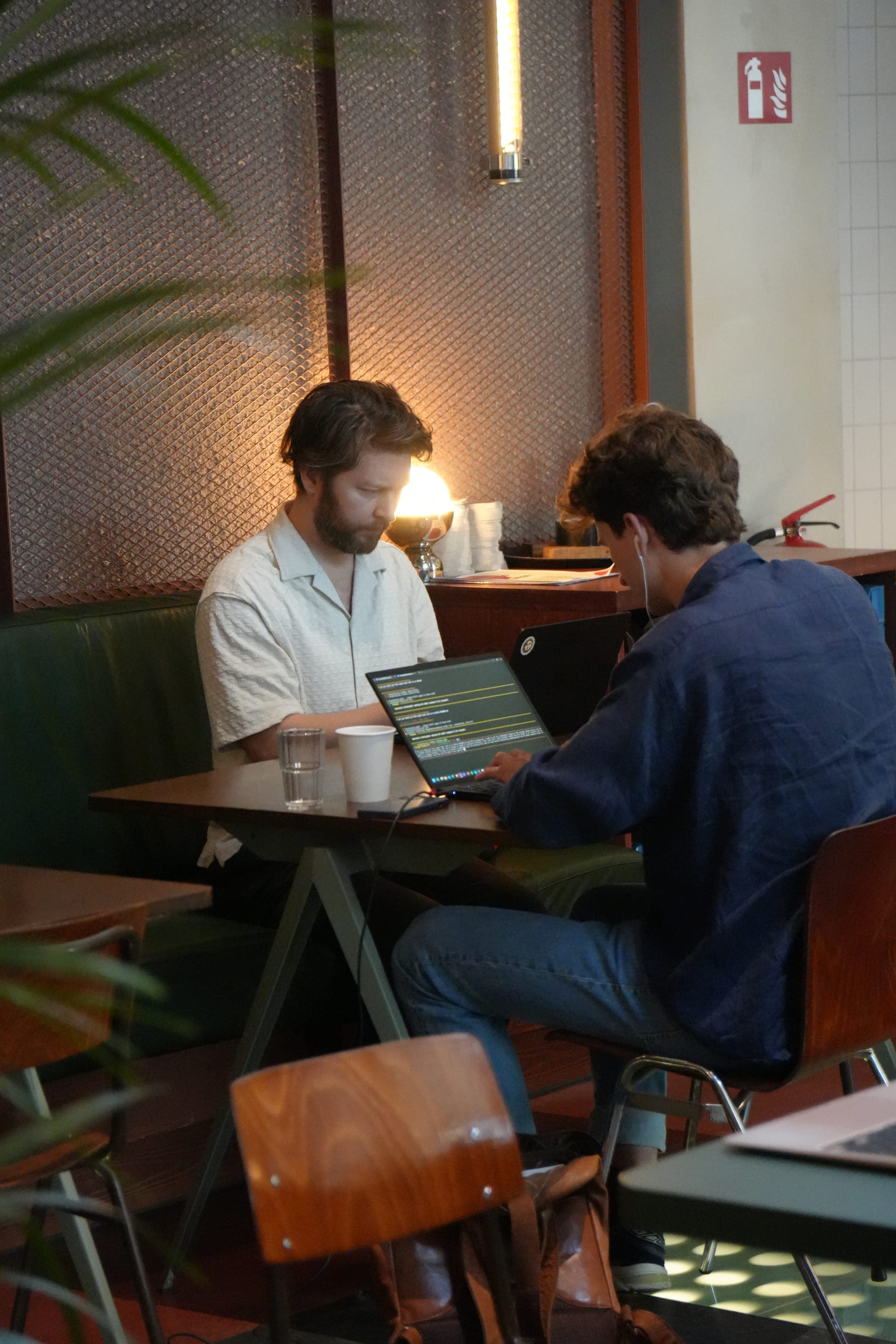 Cafe Cursor Ghent, 23 May 2026. Two builders coding at a table.