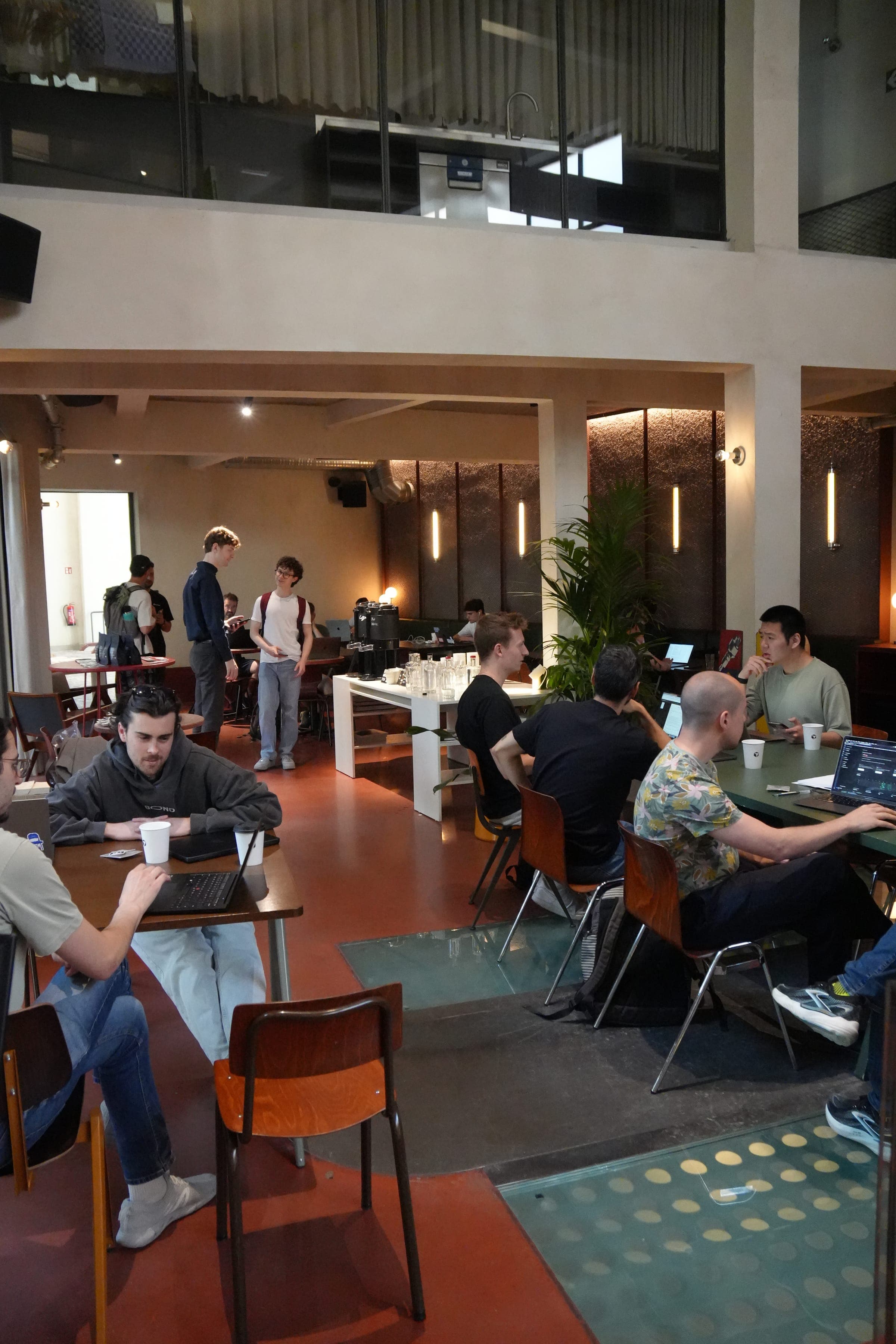 Cafe Cursor Ghent, 23 May 2026. Tables of builders and the coffee station.