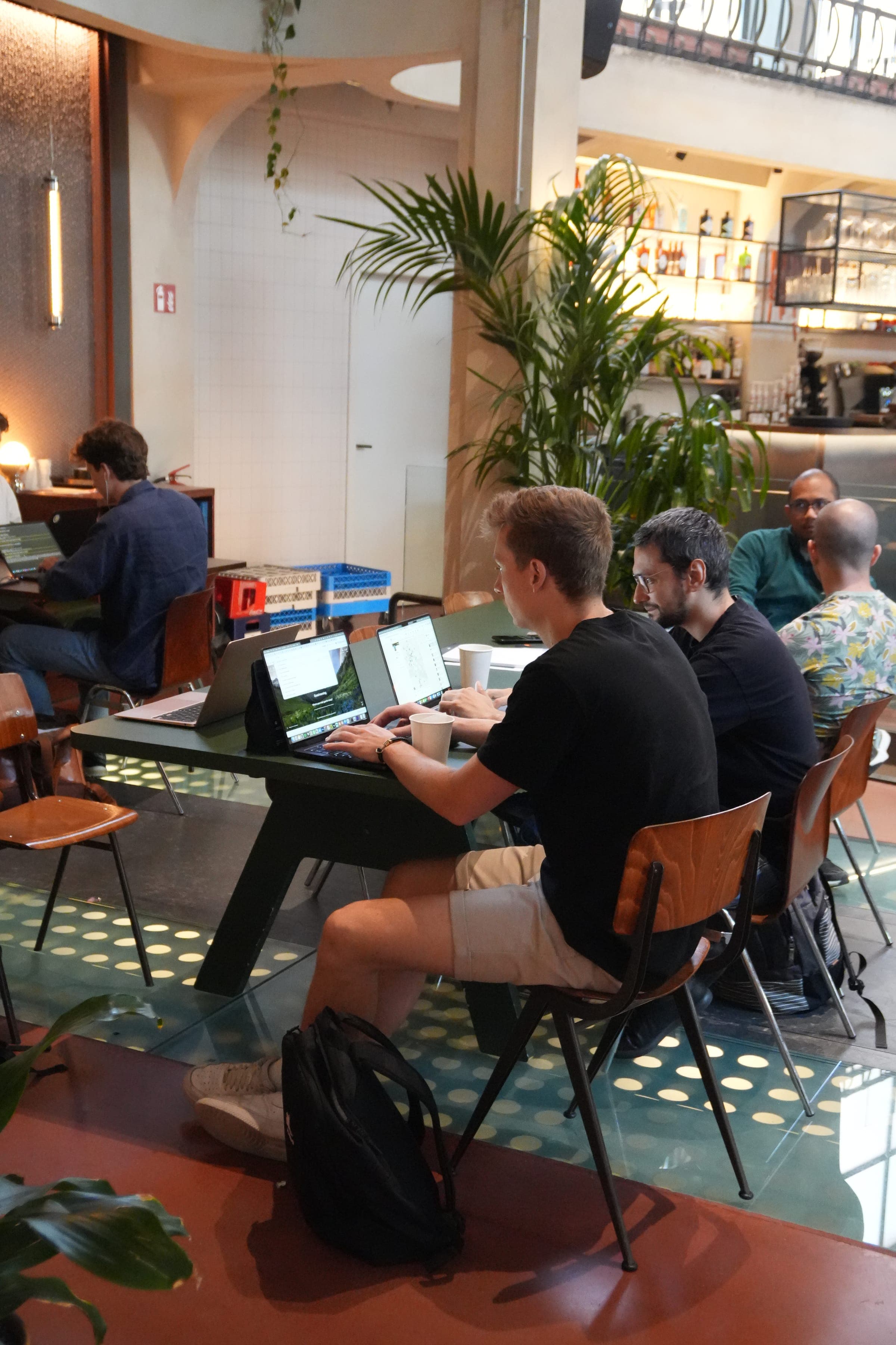 Cafe Cursor Ghent, 23 May 2026. Builders at laptops in Bar Bougie.